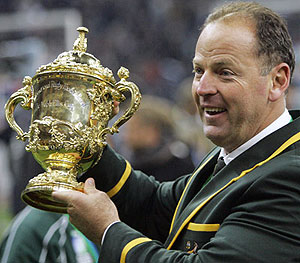 Former South African coach Jake White holds the winner's trophy after their Rugby World Cup final against England - AP Photo/Christophe Ena