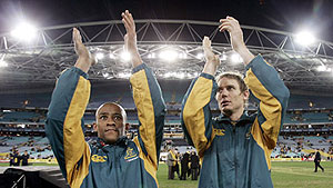 Australia’s George Gregan, and Stephen Larkham acknowledge the crowd after playing their final match in Australia  - AP Photo/Rick Rycroft