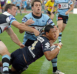 Israel Folau of Melbourne Storm scores a try during the round 2 NRL match against Cronulla Sharks. AAP Images