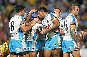 Aaron Cannings kisses Nathan Friend during the Parramatta Eels vs Gold Coast Titans match. AAP Image/Action Photographics/Grant Trouville