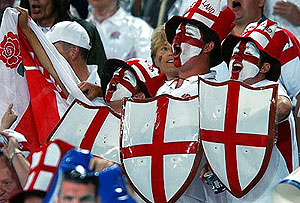 English rugby supporters cheer as their team takes to the field. AP Photo/Rick Rycroft.