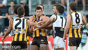 Hawthorn and Port Adelaide players wrestle during the AFL Round 08 match between the Hawthorn Hawks and Port Adelaide Power. GSP Images/Lachlan Cunningham