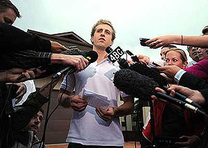 Australian butterfly champion Nick D’Arcy makes a statement to media outside his home on the Sunshine Coast in Queensland, Tuesday, May 28, 2008. AAP Image/Dave Hunt