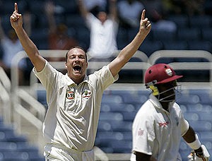 Australia\'s bowler Stuart Clark celebrates the wicket of West Indies batsman Dwayne Bravo. AP Photo/Andres Leighton