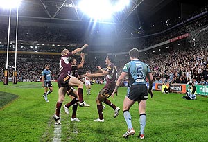 Queensland's Michael Crocker and Scott Prince (left) react with tryscorer Israel Folau during the NRL State of Origin match between Queensland and New South Wales at Suncorp Stadium in Brisbane, Wednesday, June 11, 2008. AAP Image/Dave Hunt