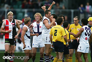 Fremantle players celebrate prematurely at the round five AFL match between the St Kilda Saints and the Fremantle Dockers at Aurora Stadium April 30, 2006 in Launceston, Australia. St Kilda tied the match when Steven Baker kicked a behind after the siren. The extra point stood as the controlling umpire failed to hear the final siren. GSP images