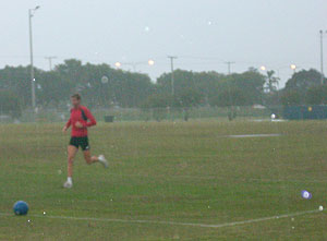 Tomkins training in the rain, when its been pissing down. we still have to do our weights.