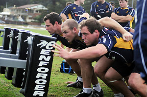 New Wallabies prop Ben Alexander (right) with Stephen Moore (centre) and Al Baxter practice their scrum setting during a training session at Manly Oval, Sydney, Thursday, June 5, 2008. The Wallabies will play Ireland in Melbourne on June 14, 2008. AAP Image/Dean Lewins