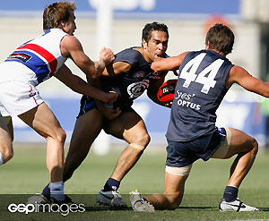 Eddie Betts from Carlton is tackled by Scott West from Western Bulldogs during the NAB Cup Regional Challenge match between the Carlton Blues and the Western Bulldogs at MC Labour Park. GSP Images
