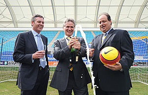 Gold Coast United FC head coach and director of football, Miron Bleiberg (centre) celebrates with Football Federation Australia (FFA) CEO Ben Buckley and Gold Coast United CEO Clive Mensink at Skilled Park on the Gold Coast, Thursday, Aug. 28, 2008. AAP Image/Dave Hunt