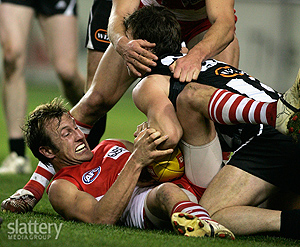 Jude Bolton of Sydney is caught up in a tackle during the AFL Round 21 match between the Collingwood Magpies and the Sydney Swans at the Telstra Dome. Slattery Images