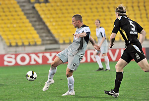 Melbourne Victory's Daniel Allsopp makes an attempt on goal in front of Wellington Phoenix's Karl Dodd during the A-League pre-season final at Westpac Stadium in Wellington, New Zealand, Wednesday, Aug. 6, 2008. AAP Image/NZPA, Ross Setford
