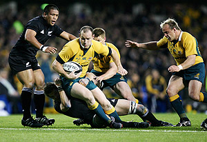 Stirling Mortlock on the attack against the All Blacks. AAP Photos
