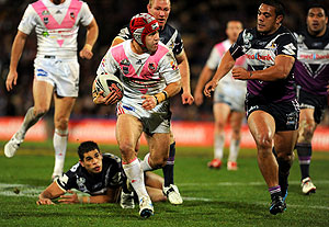 Jamie Soward is chased down by Sika Manu during NRL Round 19, Melbourne Storm vs St George Illawarra Dragons, at Olympic Park, Melbourne, Monday, July 21, 2008. Melbourne won 26-0. AAP Image/Action Photographics/Jeff Crow