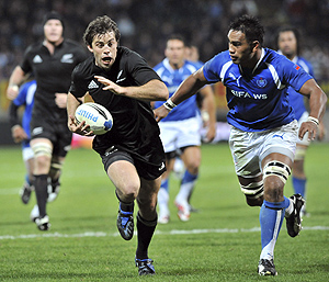 New Zealand\'s Conrad Smith, left, is chased down by Manu Samoa\'s Filipo Levi in the International rugby test at Yarrow Stadium, New Plymouth, New Zealand, Wednesday, Sept. 3, 2008. AP Photo/NZPA, Ross Setford