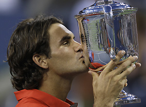 Roger Federer, of Switzerland, kisses the championship trophy after winning the men's finals championship over Andy Murray, of Britain, at the U.S. Open tennis tournament in New York, Monday, Sept. 8, 2008. AP Photo/Charles Krupa
