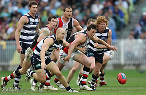 Geelong and St Kilda players fight for the ball during the AFL 1st Qualifying Final between the Geelong Cats and the St kilda Saints at the MCG. GSP Images
