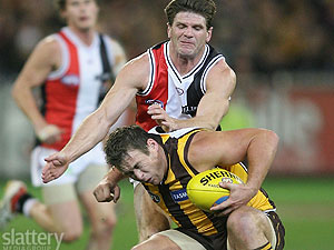 Hawthorn's Stuart Dew and St Kilda's Robert Harvey in action during the AFL 2nd Preliminary Final between the Hawthorn Hawks and the St Kilda Saints at the MCG.