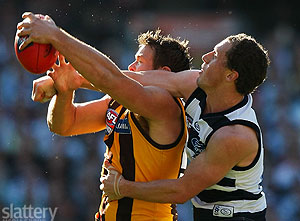 Hawthorn\'s Stuart Dew and Geelong\'s James Kelly in action during the 2008 Toyota AFL Grand Final between the Geelong Cats and the Hawthorn Hawks at the MCG. - GSP Images