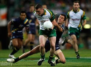 Leighton Glynn of Ireland is tackled by Kade Simpson of Australia during the First Test of the 2008 International Rules Series at Subiaco Oval in Perth. Slattery Images