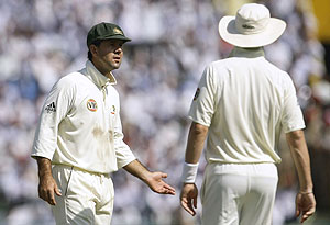 Australian captain Ricky Ponting, left, and bowler Brett Lee confer during the fourth day of the second cricket test match between India and Australia, in Mohali, India, Monday, Oct. 20, 2008. AP Photo/Gautam Singh
