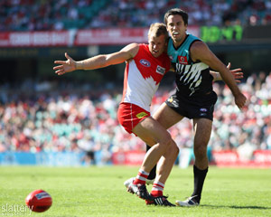 Ryan O'Keefe and Port's Troy Chaplin battle for the ball during the AFL Round 02 match between the Sydney Swans and Port Adelaide Power at the SCG. GSP Images