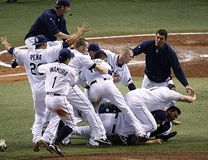 Tampa Bay Rays players celebrate after defeating the Boston Red Sox 3-1 in Game 7 to win the American League baseball championship series in St. Petersburg, Fla., Sunday, Oct. 19, 2008. AP Photo/Mike Carlson