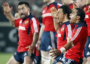 Munster's Lifeimi Mafi, right, Doug Howlett, center, and Rua Tipoki, left, perform the Haka before playing New Zealand, All Blacks in the Rugby Union challenge match at Thomond Park Stadium, Limerick, Ireland, Tuesday, Nov. 18, 2008. AP Photo/Peter Morrison
