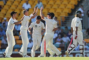 New Zealand bowler Chris Martin (2nd left) reacts after dismissing Australian batsman Andrew Symonds on day 2 of the first test match between Australia and New Zealand at the Gabba in Brisbane, Friday, Nov. 21, 2008. AAP Image/Dave Hunt