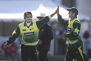 Pakistan's Fawad Alam, left, celebrates with Shoaib Malik after the Canada Cup 20/20 game between Pakistan and Zimbabwe, in King City, Ontario, on Sunday, Oct. 12, 2008. AP Photo/The Canadian Press,Chris Young