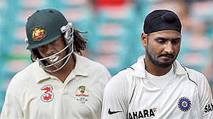 India’s Harbhajan Singh, right, and Australia’s Andrew Symonds - AP Photo/Rob Griffith