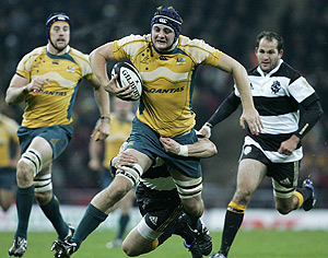 Australian Wallaby Dean Mumm is tackled during their commemorative match against the Barbarians at Wembley Stadium, London, England, Wednesday, Dec 3, 2008. Australia won the match 18-11. AAP Image/Tim Hales