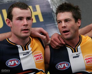 Shannon Hurn (L) & Ben Cousins (R) of the West Coast Eagles sing the song after the AFL Round 19 match between the Kangaroos and West Coast Eagles at the Telstra Dome. Slattery Image Group images