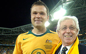 Australia's Mark Viduka with Soccer Australia President Frank Lowry after Australia defeated Uruguay during the 2006 FIFA World Cup Qualifier match at Telstra Stadium, Sydney, Wednesday, Nov. 16, 2005. Australia defated Uruguay in a penalty shoot out qualifying them for the World Cup in Germany. (AAP Image/Dean Lewins) 