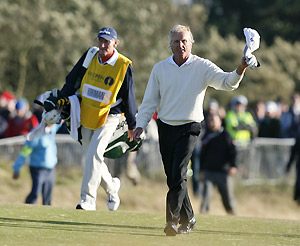 Greg Norman of Australia waves as he walks down the 18th fairway during the third round of the British Open Golf championship, at the Royal Birkdale golf course, Southport, England, Saturday, July 19, 2008. AP Photo/Paul Thomas