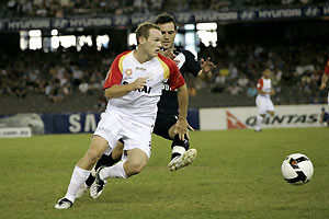 Kristian Sarkies (left) and Billy Celeski in action during Hyundai A-League replay match between Melbourne Victory v Adelaide United at Telstra Dome, Melbourne, Tuesday, Jan. 6, 2009. AAP Image/Raoul Wegat