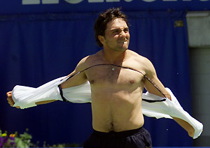 Australia's Andrew Ille rips off his shirt after defeating Juan Carlos Ferrero of Spain by 3-6, 6-2, 6-1, 1-6, 6-2, at the Australian Open Tennis Championship in Melbourne, Australia, Wednesday, Jan. 17, 2001. AP Photo/Trevor Collens
