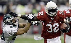 Arizona Cardinals running back Edgerrin James, right, carries the ball as Philadelphia Eagles safety Quintin Demps defends during the first half of the NFL NFC Championship football game Sunday, Jan. 18, 2009, in Glendale, Ariz. AP Photo/David J. Phillip