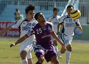 Mashal's Viktor Klishin, 20, and Al Ain's Humaid Majeed, 25, fight for the ball during an Asian Champions League Group B match between Mashal, Uzbekistan, and Al Ain, United Arab Emirates, in Qarshi, 500 km (310 miles) southwest of Tashkent, Uzbekistan, Wednesday, March 22, 2006. The match ended in a 1-1 draw. AP Photo