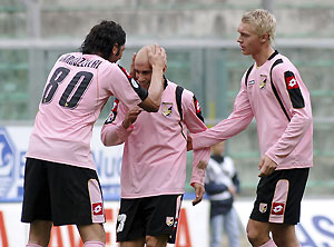 Palermo midfielder Mark Bresciano, center, of Australia, celebrates with his teammates Morris Carrozzieri, left, and Simon Kjaer, of Denmark, after scoring during the Serie A soccer match between Palermo and Atalanta, in Palermo, Italy, Sunday, Jan 11 2009. AP Photo/Alessandro Fucarini