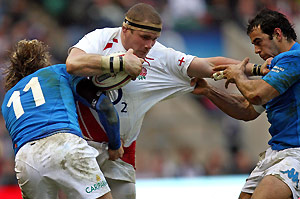 England's Phil Vickery, center, tries to muscle his way through the Italian defence during the Six Nations rugby union international match at Twickenham stadium in London, Saturday Feb. 7, 2009. AP Photo/PA, David Davies