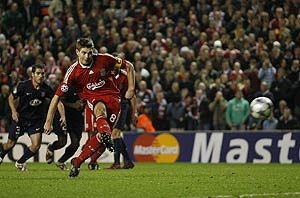 Liverpool's Steven Gerrard scores from the penalty spot against Athletico Madrid during their Champions League, Group D, soccer match at Anfield Stadium, Liverpool, Tuesday, Nov. 4, 2008. AP Photo/Paul Thomas