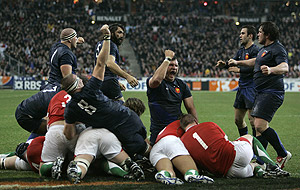 Captain of the French rugby team, Lionel Nallet, center, reacts after Thierry Dusautoir scored the first try for France during the Six Nations rugby union international match France vs Wales, Friday, Feb. 27, 2009 in the Stade de France in Paris. AP Photo/Lionel Cironneau