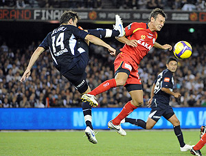 Melbourne Victory's Billy Celeski challenges Adelaide United's Sasa Ognenovski in the A-League football final match, at the Telstra Dome, in Melbourne, Saturday, Feb. 28, 2009. Victory beat United 1-0. AAP Image/Martin Philbey