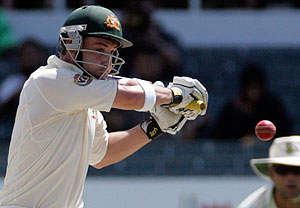 Australia's batsman Phillip Hughes, left, plays a shot as South Africa's fielder Jacques Kallis, right, follows play during the third day of the second test match at Kingsmead stadium in Durban, South Africa, Sunday March 8, 2009. (AP Photo/Themba Hadebe) 