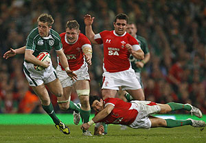 Ireland's Luke Fitzgerald, left, takes on the Welsh defence during their Six Nations rugby union international match at the Millenium Stadium, Cardiff, Saturday March 21, 2009. AP Photo/Paul Thomas