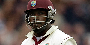 West Indies batsman Chris Gayle leaves the field after being bowled by England's Stuart Broad during the second day of the first Test match between England and West Indies at Lord's cricket ground in London, Thursday, May 7, 2009. (AP Photo/Matt Dunham)
