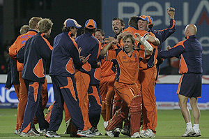 The Netherlands cricket team celebrate after defeating England in their Twenty20 World Cup cricket match at Lord's cricket ground in London, Friday, June, 5, 2009. AP Photo/Alastair Grant