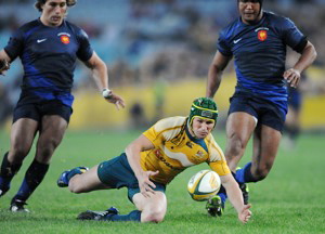 Australia's Matt Giteau slides in to gather up a loose ball during the Australia v France Rugby Union test at ANZ Stadium, Sydney, Saturday, June 27, 2009. (AAP Image/Dean Lewins)