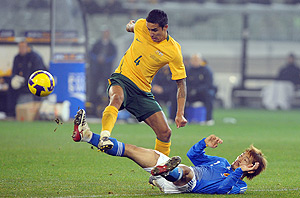 Australia's Tim Cahill wins the ball against Abe Yuki of Japan, during their final match of the Asia Qualifiers round for the 2010 World Cup, in Melbourne, Wednesday, June 17, 2009. Australia beat Japan 2-1, with both countries having already qualified for next year's World Cup in South Africa. AAP Image/Joe Castro